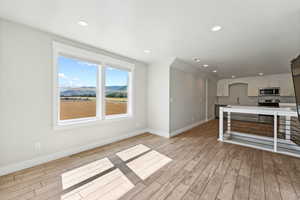 Living Room with Mountain Views in Upstairs Apartment