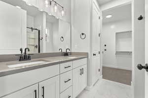 Bathroom featuring vanity and a shower with shower door