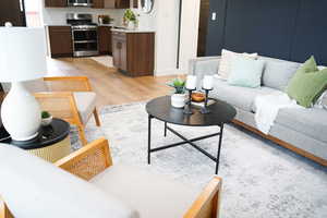 Living room with light wood-type flooring