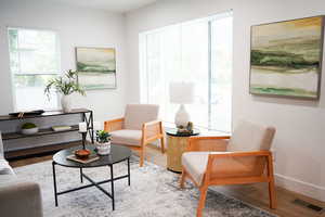 Living room with hardwood / wood-style flooring