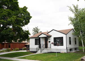 View of front of property featuring a front lawn