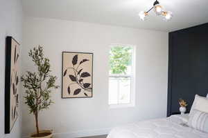 Bedroom with an inviting chandelier