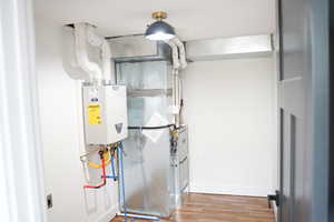 Utility room featuring water heater