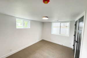 View of carpeted spare room