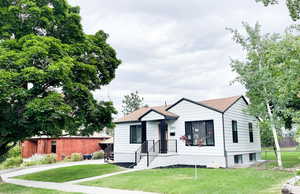 View of front of property with a front yard