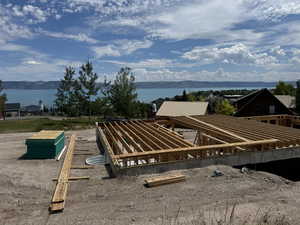 Exterior space featuring a water and mountain view