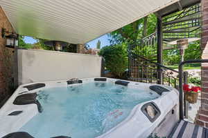 Exterior space featuring a hot tub