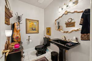 Bathroom with tile patterned flooring and toilet