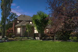 View of front of home with a yard