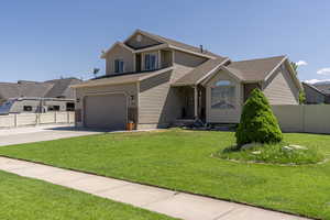 View of front of property featuring a front lawn