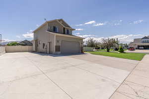 Front of property featuring a garage and a front yard