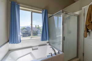 Bathroom featuring plus walk in shower