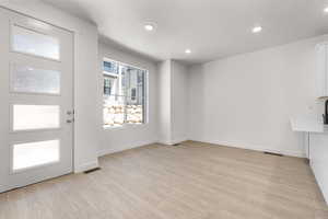 Interior space with light hardwood / wood-style flooring