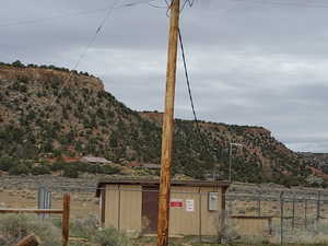 One of the pumphouses owned by the city. Power pole on property