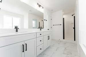 Bathroom with vanity and walk in shower