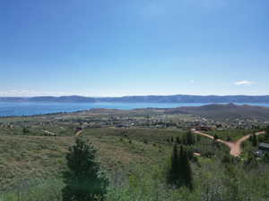 Property view of mountains with a water view