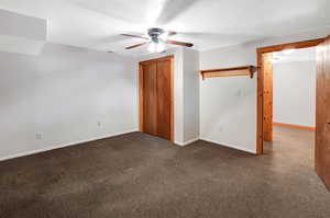 Unfurnished bedroom featuring a closet and ceiling fan