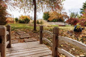 View of wooden bridge in backyard