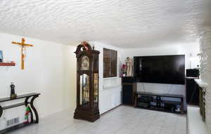 Living room featuring light tile patterned floors