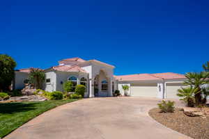 Mediterranean / spanish home with a garage