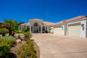 Mediterranean / spanish house featuring a garage