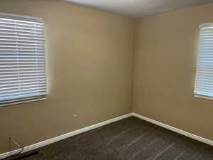 Unfurnished room featuring carpet