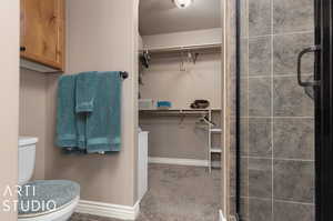 Primary ensuite bathroom. Toilet, shower and primary closet