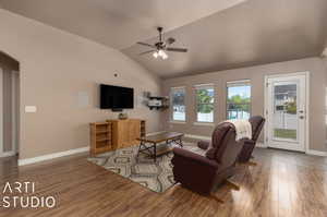 Living room with bank of windows and back door leading to the back yard