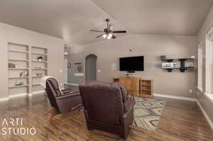 Living room with built in book shelves and surround sound