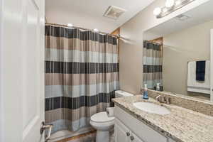 Bathroom with vanity and toilet