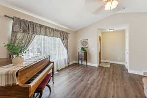 Sitting room featuring lofted ceiling, ceiling fan, and hardwood / wood-style floors