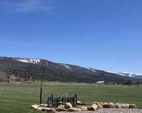 Property view of mountains with a rural view
