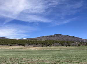 View of mountain feature with a rural view