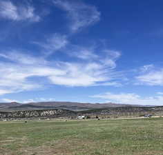 View of mountain feature with a rural view