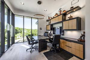 Office area featuring light wood-style flooring
