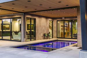 Indoor pool with a patio area