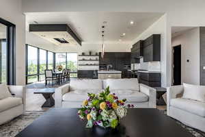 Living room featuring light wood-type flooring and recessed lighting