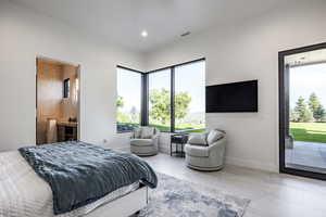 Bedroom featuring access to exterior, baseboards, ensuite bath, and recessed lighting