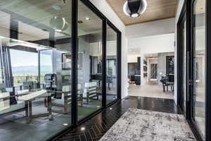 Hall featuring a mountain view and wooden ceiling
