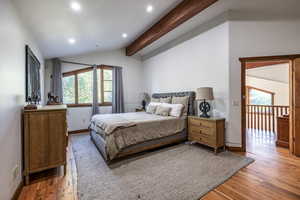 Bedroom with light wood-style flooring, recessed lighting, and baseboards