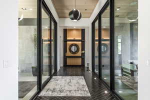 Hall with wooden ceiling and french doors