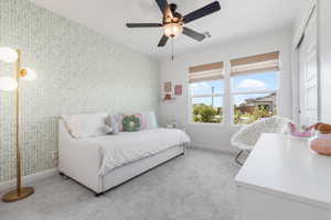 Bedroom with light carpet and ceiling fan