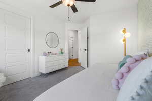 Bedroom with wood-type flooring and ceiling fan