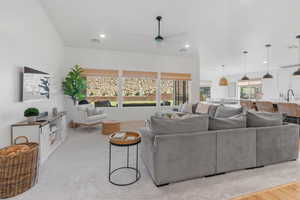 Living room featuring light hardwood / wood-style flooring, sink, and ceiling fan