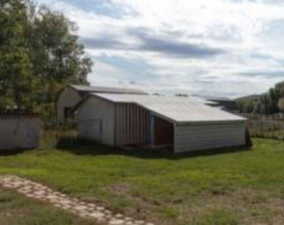 Haybarn, with tack room, extended dog run, corral, and barn extension. Separate tool shed as well,