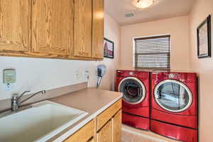 Quality appliances on pedestals with folding area, deep sink and deep locking linen closet stocked with towels.