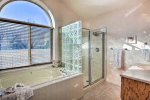 Master en suite with tile flooring, deep European jetted tub, and large walk in shower--and a view of the serene Nordic Valley slopes!