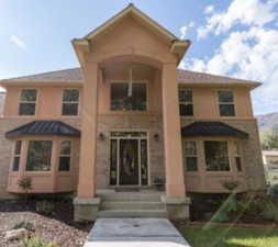 Special architectural features include 2-story entrance, bay windows, and inviting porch.