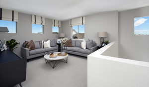 Living room featuring carpet.This is a picture of the model home; selections and colors may vary.