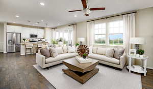 Living room with LVT flooring. Ceiling fans and pendant lights have not been selected for this home.Materials and colors may vary; this pictures is of a model home.